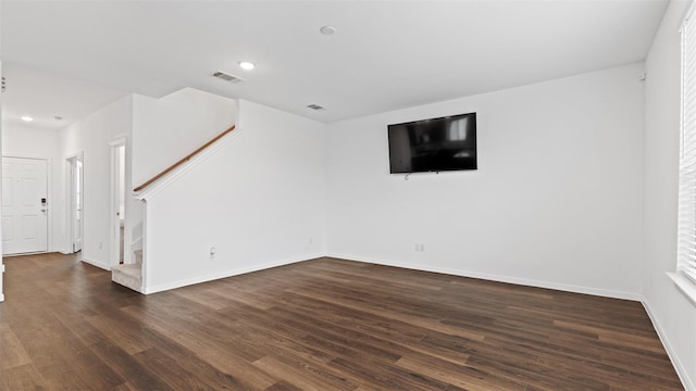 321 Lippizan Dr, Alvin, TX 77511 - unfurnished living room with stairway, dark wood-style flooring, baseboards, and recessed lighting