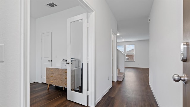 321 Lippizan Dr, Alvin, TX 77511 - corridor featuring dark wood finished floors, stairway, and baseboards