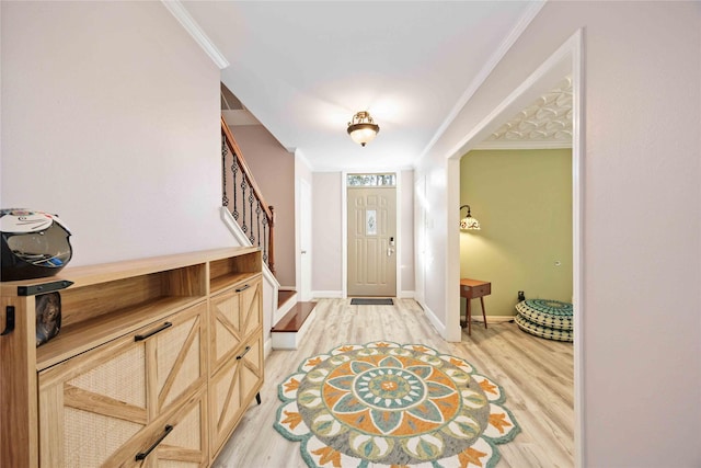 7906 Beaufort Dr, Spring, TX 77379 - entrance foyer featuring ornamental molding, stairs, light wood finished floors, and baseboards