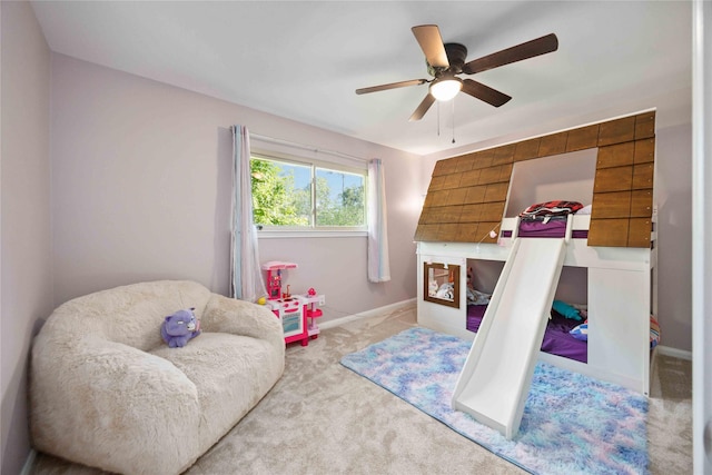 7906 Beaufort Dr, Spring, TX 77379 - carpeted bedroom with baseboards and a ceiling fan
