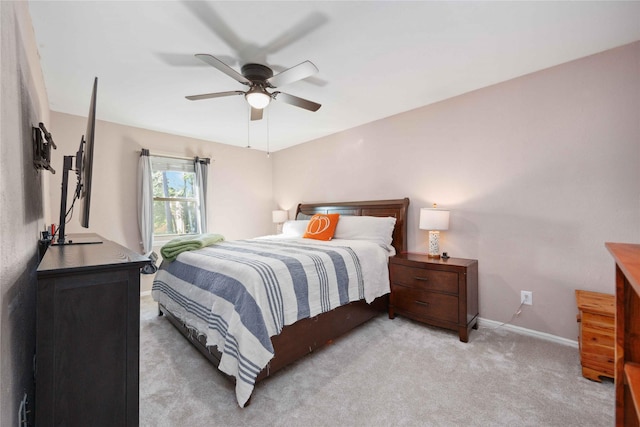 7906 Beaufort Dr, Spring, TX 77379 - bedroom with baseboards, light carpet, and ceiling fan