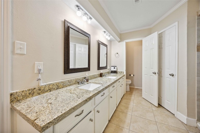 7906 Beaufort Dr, Spring, TX 77379 - full bath featuring toilet, double vanity, tile patterned floors, crown molding, and baseboards