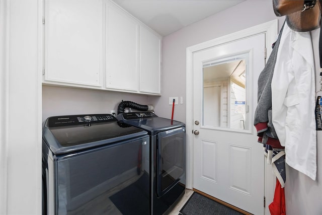 7906 Beaufort Dr, Spring, TX 77379 - laundry area with washing machine and clothes dryer and cabinet space