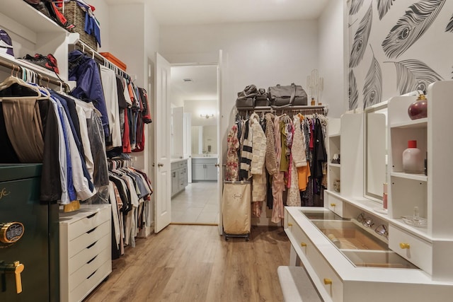 walk in closet featuring light wood-type flooring