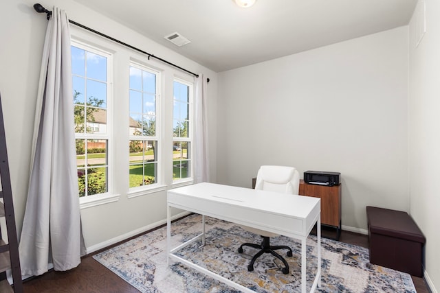office area with baseboards and dark wood finished floors
