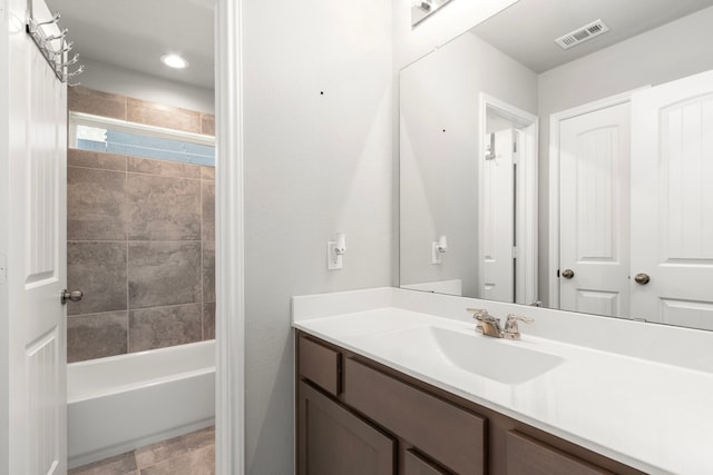 full bathroom with vanity and shower / bath combination