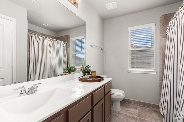 bathroom with vanity, tile patterned floors, toilet, baseboards, and curtained shower