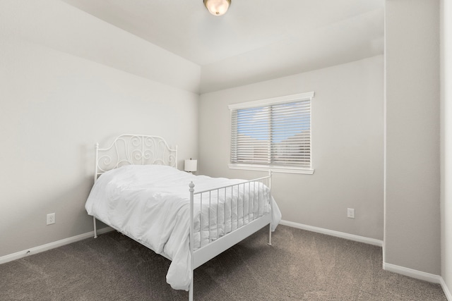 carpeted bedroom featuring baseboards