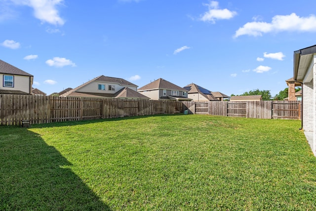 view of yard featuring a residential view