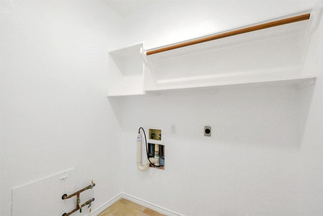 19415 Indian Hawthorn Dr, Houston, TX 77094 - clothes washing area with gas dryer hookup, washer hookup, hookup for an electric dryer, and baseboards