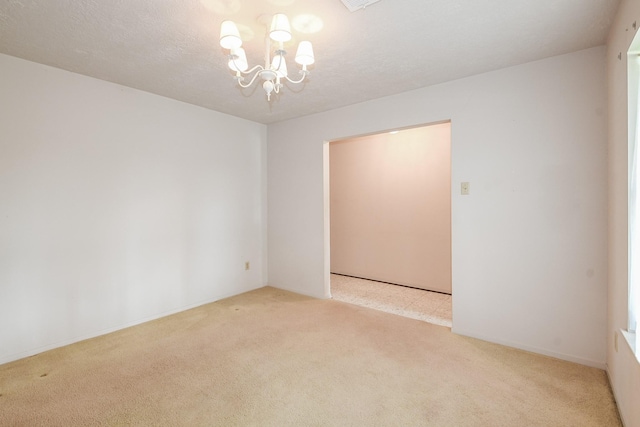 1902 S Memorial Ct, Pasadena, TX 77502 - unfurnished room with a chandelier and carpet