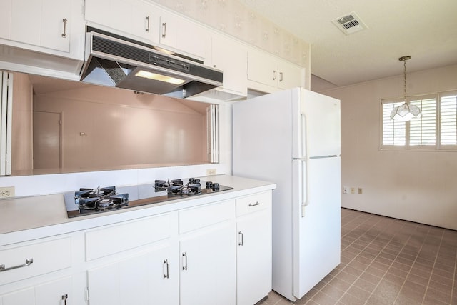 1902 S Memorial Ct, Pasadena, TX 77502 - kitchen featuring under cabinet range hood, black electric cooktop, white cabinets, light countertops, and pendant lighting