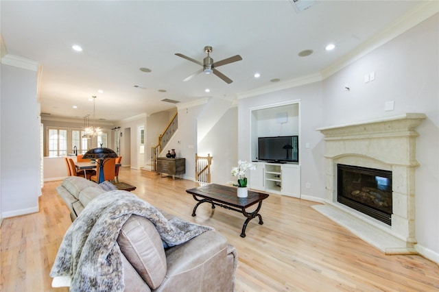 3331 Bingham Manor Ln, Houston, TX 77056 - living room with ornamental molding, stairs, a ceiling fan, light wood-type flooring, and a premium fireplace