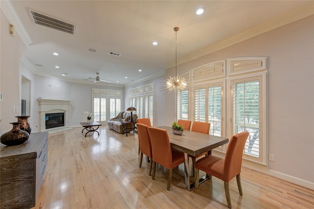 3331 Bingham Manor Ln, Houston, TX 77056 - dining room featuring ornamental molding, a premium fireplace, light wood finished floors, recessed lighting, and baseboards