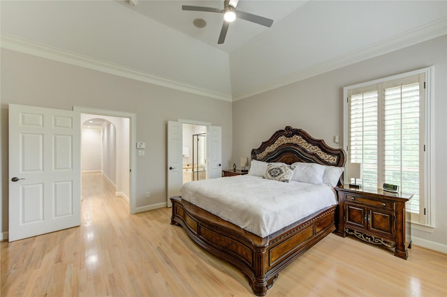 3331 Bingham Manor Ln, Houston, TX 77056 - bedroom featuring arched walkways, light wood-type flooring, baseboards, ornamental molding, and connected bathroom
