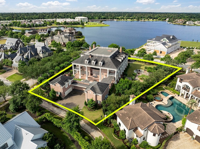 aerial view of residential area featuring property parcel outlined and a nearby body of water
