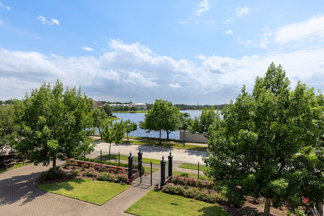 view of home's community with a water view