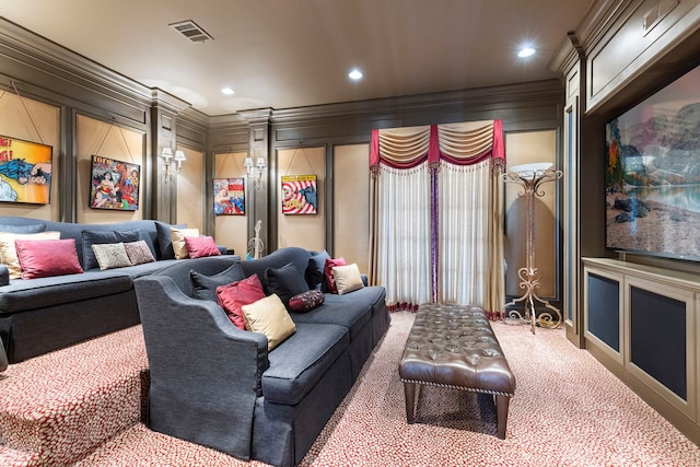 home theater room with ornamental molding, recessed lighting, carpet flooring, and a decorative wall