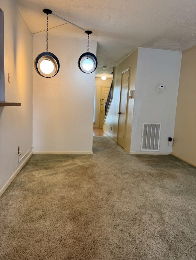 13424 Castilian Dr Unit 113, Houston, TX 77015 - spare room with carpet, a textured ceiling, and baseboards