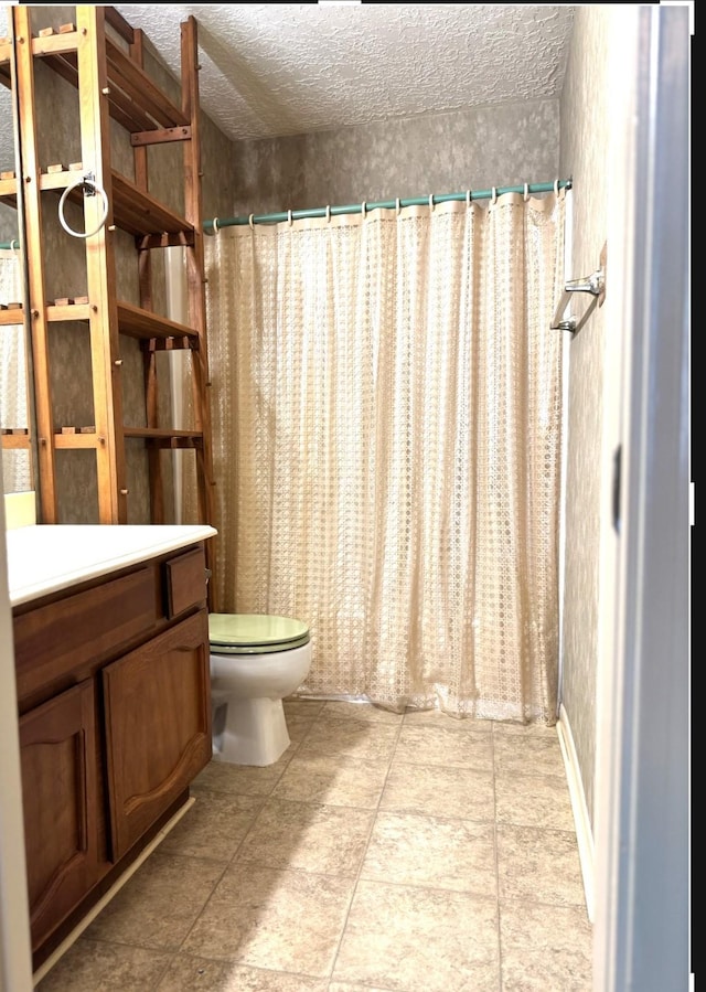 13424 Castilian Dr Unit 113, Houston, TX 77015 - bathroom with toilet, a textured ceiling, vanity, and a shower with curtain