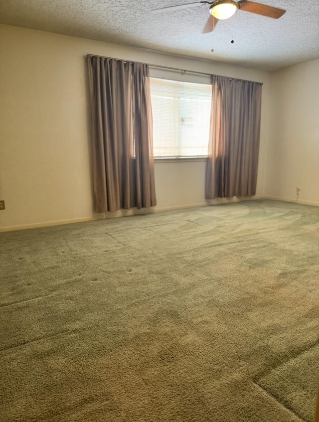 13424 Castilian Dr Unit 113, Houston, TX 77015 - carpeted empty room featuring a textured ceiling, ceiling fan, and baseboards