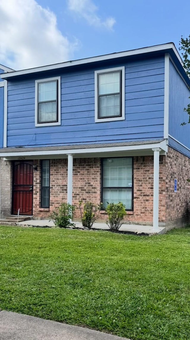 13424 Castilian Dr Unit 113, Houston, TX 77015 - traditional home featuring a front yard and brick siding