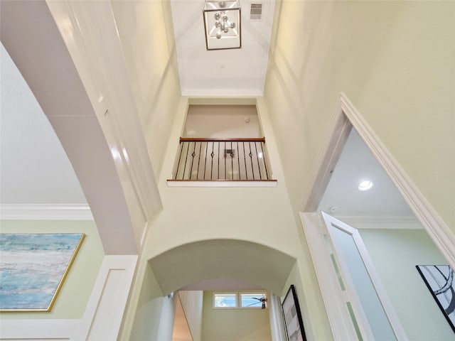 4635 Beech St, Bellaire, TX 77401 - stairs featuring a high ceiling and arched walkways