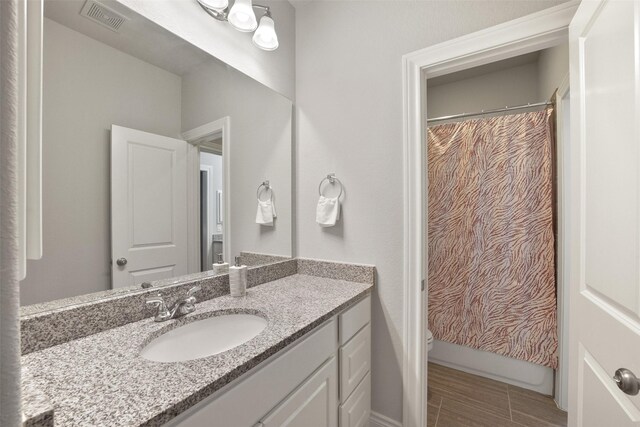 9223 Holloway Cliff Ln, Cypress, TX 77433 - full bath featuring vanity and toilet