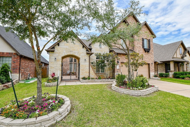 4414 Tilbury Trl, Richmond, TX 77407 - view of front of home with concrete driveway, stone siding, an attached garage, and brick siding