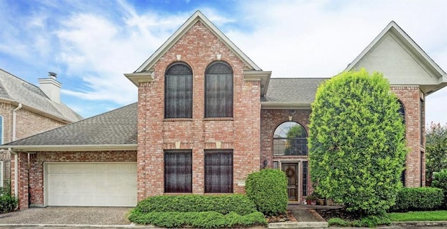 1265 Ridgewood Pl, Houston, TX 77055 - traditional-style house with a shingled roof and brick siding