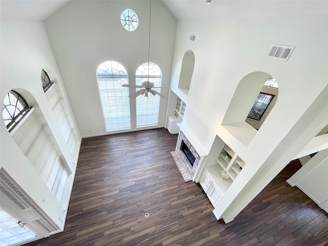 1265 Ridgewood Pl, Houston, TX 77055 - foyer featuring a high ceiling, a brick fireplace, ceiling fan, dark wood finished floors, and baseboards