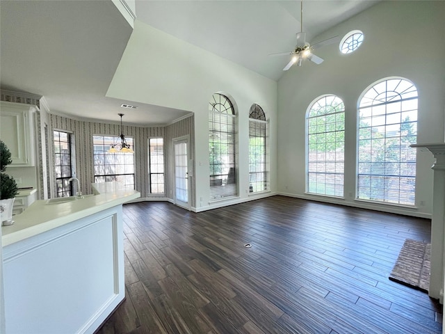 1265 Ridgewood Pl, Houston, TX 77055 - unfurnished living room with a sink, a ceiling fan, dark wood-style flooring, a chandelier, and baseboards