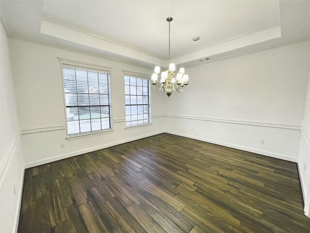 1265 Ridgewood Pl, Houston, TX 77055 - unfurnished room with a tray ceiling, ornamental molding, a chandelier, dark wood finished floors, and baseboards
