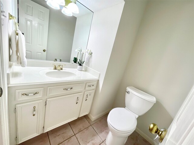 1265 Ridgewood Pl, Houston, TX 77055 - bathroom featuring vanity, toilet, tile patterned floors, and baseboards