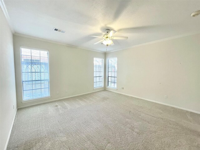 1265 Ridgewood Pl, Houston, TX 77055 - unfurnished room with crown molding, baseboards, ceiling fan, light carpet, and a smoke detector