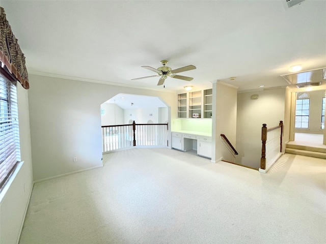 1265 Ridgewood Pl, Houston, TX 77055 - unfurnished living room featuring attic access, ceiling fan, baseboards, light colored carpet, and ornamental molding