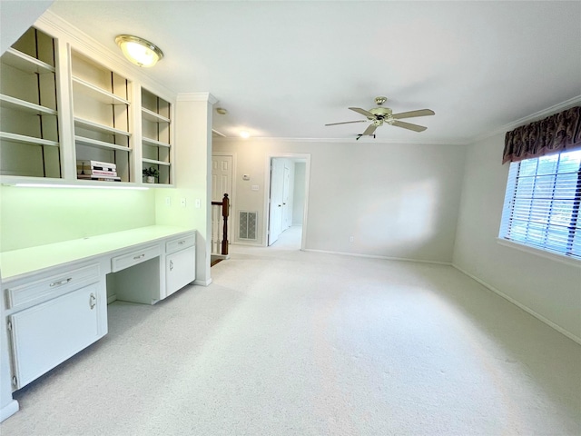 1265 Ridgewood Pl, Houston, TX 77055 - unfurnished office featuring built in study area, ceiling fan, baseboards, light carpet, and ornamental molding