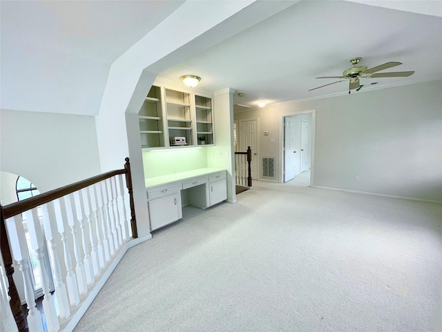 1265 Ridgewood Pl, Houston, TX 77055 - interior space featuring an upstairs landing, light colored carpet, an office area, ornamental molding, and baseboards