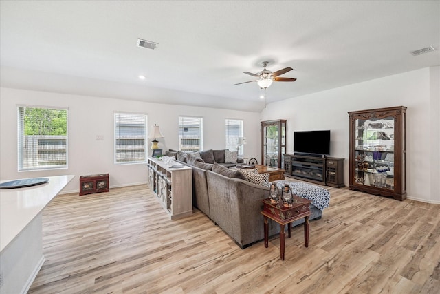 living room featuring light wood-style floors, ceiling fan, baseboards, and recessed lighting