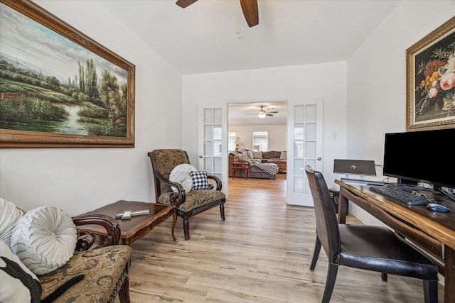 office space featuring a ceiling fan and light wood-type flooring