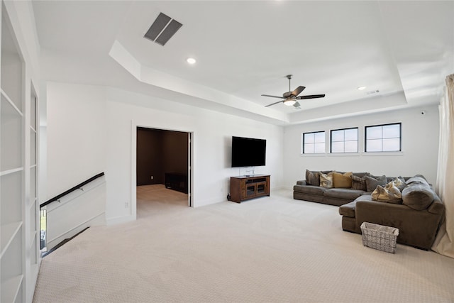 21502 Lowlands Ln, Cypress, TX 77433 - living area featuring a tray ceiling, a ceiling fan, carpet floors, recessed lighting, and baseboards