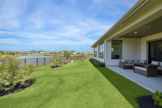 21502 Lowlands Ln, Cypress, TX 77433 - view of yard with an outdoor living space, a water view, a patio, and a residential view