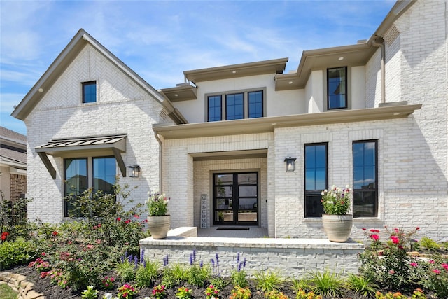 21502 Lowlands Ln, Cypress, TX 77433 - view of exterior entry featuring brick siding