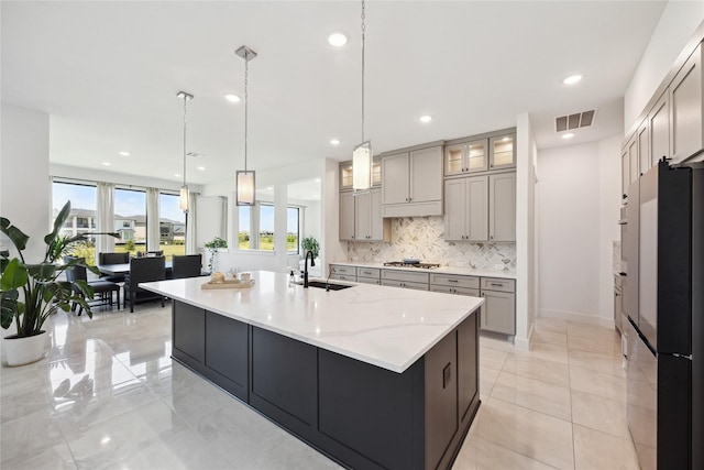 21502 Lowlands Ln, Cypress, TX 77433 - kitchen featuring a sink, gray cabinets, stainless steel appliances, decorative backsplash, and recessed lighting