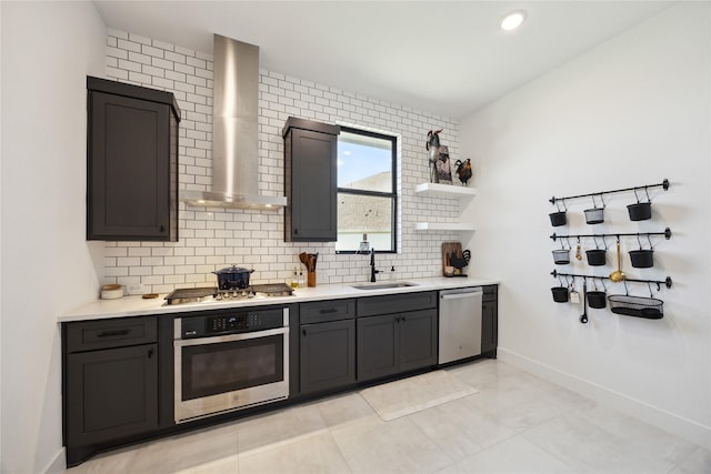 21502 Lowlands Ln, Cypress, TX 77433 - kitchen with appliances with stainless steel finishes, a sink, wall chimney exhaust hood, and light countertops