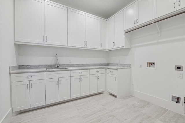 laundry area featuring hookup for a washing machine, electric dryer hookup, cabinet space, and baseboards