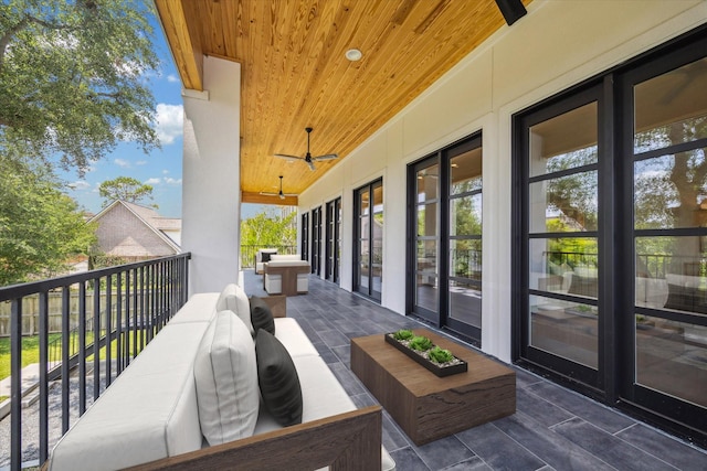 balcony with ceiling fan and outdoor lounge area
