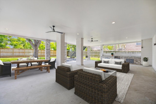 view of patio featuring an outdoor hangout area, a fenced backyard, a ceiling fan, and outdoor dining area