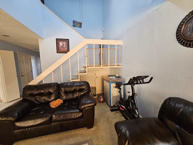 9807 Bent Branch Ln, Dallas, TX 75243 - living area with carpet flooring, stairs, and a high ceiling