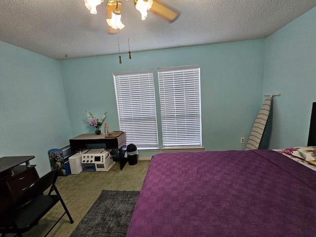 9807 Bent Branch Ln, Dallas, TX 75243 - bedroom with carpet flooring, a textured ceiling, and ceiling fan